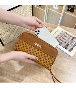 Detailed view of color block long wallet showing large capacity for storing a smartphone