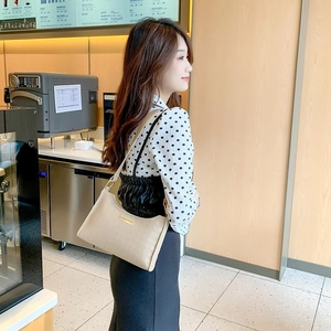 Chic beige woven underarm shoulder bag for women with elegant gold metal hardware