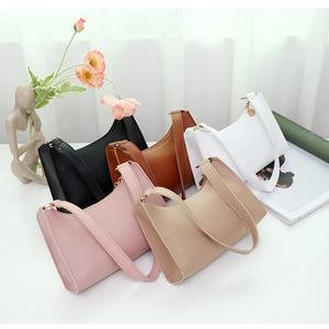Detailed collection of minimalist leather shoulder bags in five colors on a clean surface