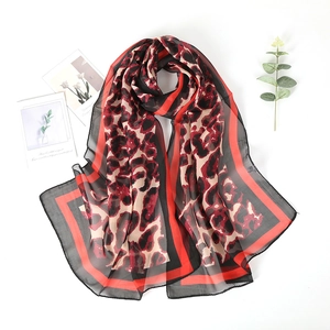 Fashionable leopard print chiffon scarf for women featuring a bold red border design