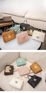 Detailed display of vintage monogram printed handbags in six colors with gold metal locks
