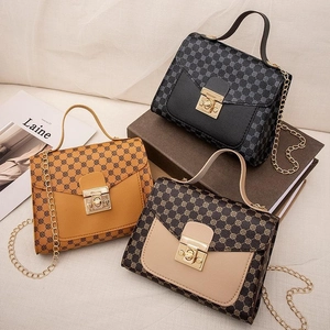 Three elegant vintage printed handbags with gold chain straps in black brown and orange
