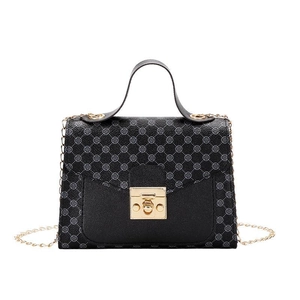 Elegant black top handle crossbody bag with geometric pattern and gold chain strap