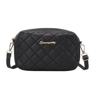 Classic black quilted crossbody camera bag with gold logo and adjustable shoulder strap