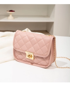 Close-up of pink quilted flap bag with golden twist lock and chain strap detail