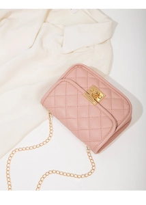 Detailed view of pink quilted leather cross-body bag with golden twist-lock and chain