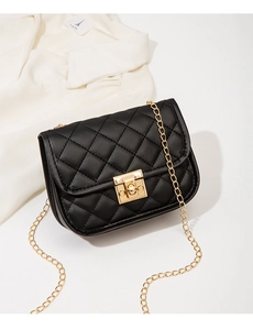 Close-up of black quilted crossbody bag featuring golden twist-lock and chain strap