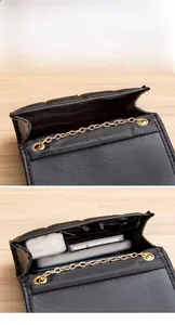 Detail view of the spacious inner compartment of this quilted black chain flap bag