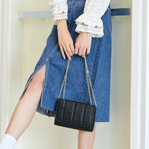 Classic black quilted chain crossbody bag with golden strap for casual fashion styling