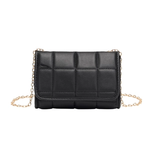 Quilted black leather crossbody bag with flap cover and golden metal chain strap