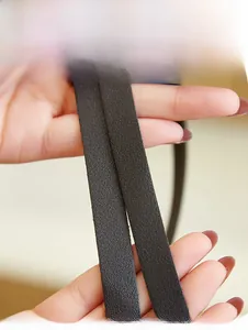Detail of soft leather shoulder straps with fine grain texture for a ladies tote bag