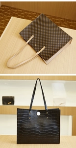 Detail view of large tote bags in vintage geometric pattern and black crocodile texture