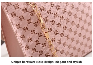 Close-up of pink ladies shoulder bag with gold chain strap and clover pattern