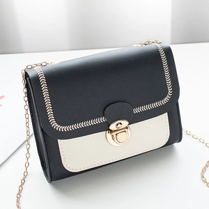 Black and white contrast leather crossbody bag with gold chain and embroidery detail
