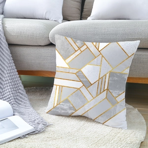 Housse de coussin géométrique moderne avec lignes grises et dorées sur canapé