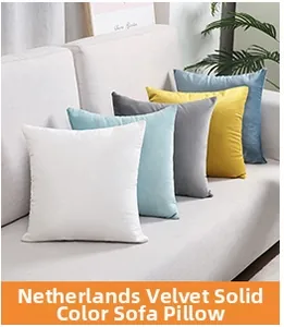 Detail of square Dutch velvet throw pillows in white, blue, yellow, and grey on sofa