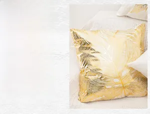 Detail of soft plush cream pillowcase with golden leaf vein print and thick fabric texture