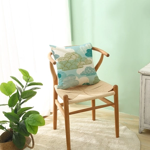 Minimalist polyester cushion cover with blue floral cloud pattern on a wooden chair