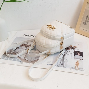 Quilted white mini backpack with gold horse emblem and diamond stitch pattern