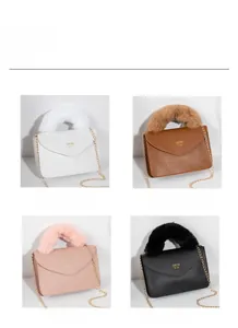 Mini handbag display in white, brown, pink and black with fur handle and gold chain