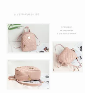 Details des rosa gesteppten Mini-Rucksacks mit goldenen Reißverschlüssen und Rautenmuster