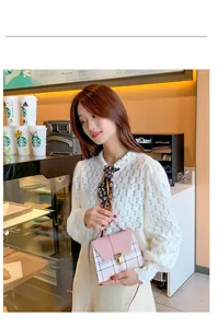 Chic pink plaid mini shoulder bag for women styled with a white lace top and scarf