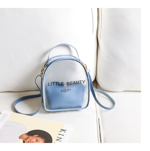 Blue semi-transparent mini backpack featuring a Little Beauty text print on fabric sofa