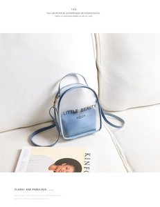 Detailed macro view of frosted transparent PVC backpack with Little Beauty letter print