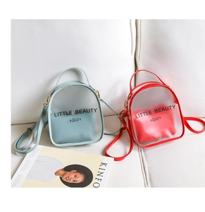 Detail of mini transparent crossbody bags in blue and red with inner lining pouches