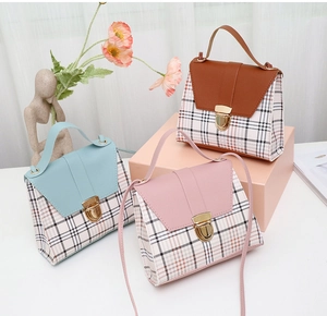 Three mini plaid crossbody bags in brown pink and blue with gold metal buckles