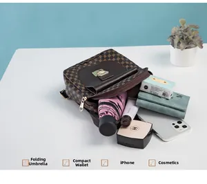 Detailed interior view showing large capacity for umbrella, wallet and phone in brown bag