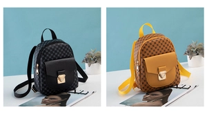 Detail of vintage monogram mini backpack featuring golden metal lock and leather texture