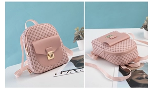 Close-up of pink PU leather mini backpack showing geometric pattern and gold push-lock
