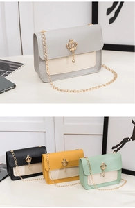 Détail du mini sac à chaîne avec fermoir couronne dorée et quatre options de couleur