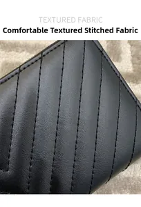 Macro detail of high-quality black faux leather fabric with stylish V-shaped embroidery