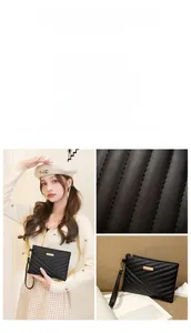 Detail of black quilted leather clutch featuring elegant diagonal stitching and gold metal logo