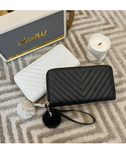 Chic long V-quilted wallets in black and white with wristlet and fluffy pompom detail