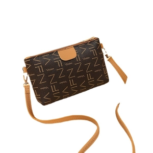 Brown vintage printed crossbody bag for women with monogram patterns and gold hardware