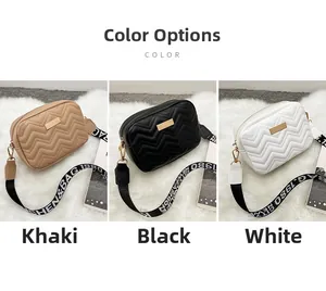 Close-up of V-quilted faux leather crossbody bags with patterned adjustable canvas straps