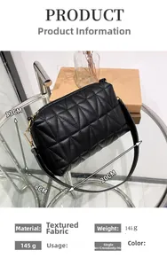 Detail view of black quilted shoulder bag with dimensions 20cm x 13cm and chain strap