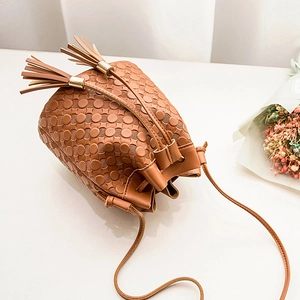 Brown embossed PU leather bucket bag with dual tassels and drawstring closure
