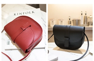 Detail view of mini saddle crossbody bag in red and black with smooth leather texture