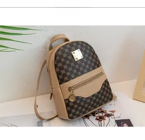Detail of mini backpack with contrast circles print and golden zipper pendant