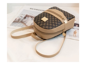 Detailed shot of mini backpack featuring retro circle print and gold tone metal hardware