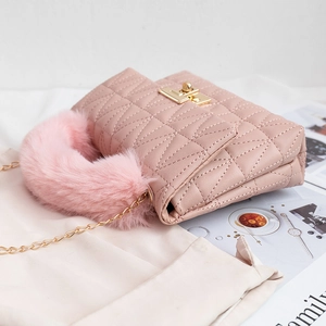 Pink quilted shoulder bag with faux fur handle and gold chain strap in chic style