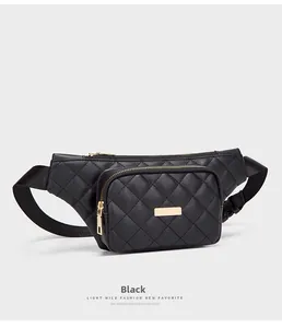 Detail of black quilted waist bag featuring gold zippers and adjustable strap buckle