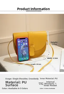 Macro view of yellow saddle bag showing 20.5x5.5x17cm dimensions on marble surface