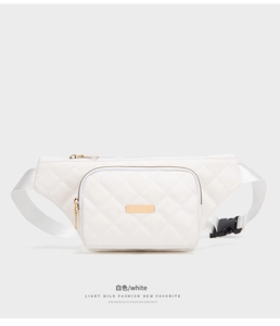 Detail of white quilted faux leather waist bag with gold zippers and rectangular plaque