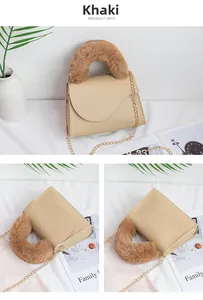 Detail view of khaki crossbody bag with fluffy plush handle and gold chain strap