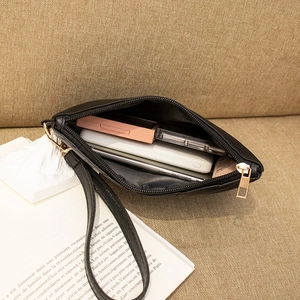 Minimalist black PU leather wristlet clutch with gold zipper and stylish quilted stitching